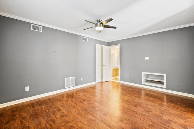 821 Mcadoo St, Little Rock, AR 72205 - unfurnished bedroom featuring ornamental molding, wood finished floors, baseboards, and a ceiling fan