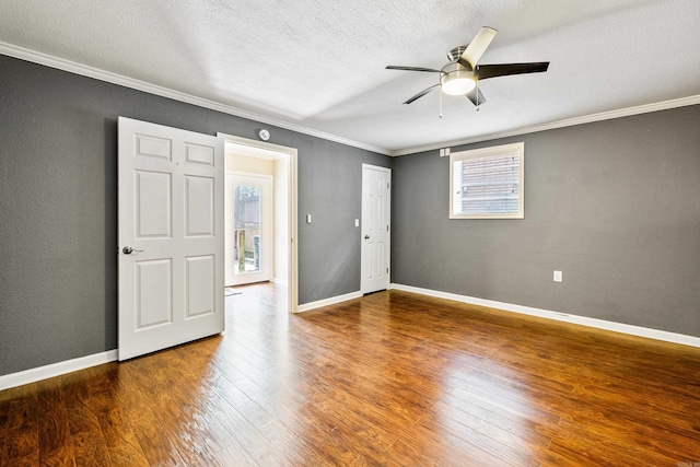 821 Mcadoo St, Little Rock, AR 72205 - unfurnished room with crown molding, wood finished floors, a ceiling fan, a textured ceiling, and baseboards