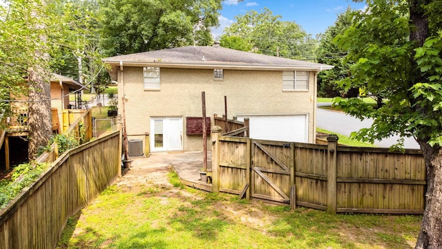 821 Mcadoo St, Little Rock, AR 72205 - back of property with a gate, an attached garage, and cooling unit