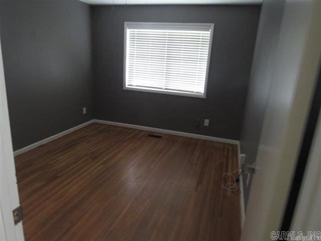 821 Mcadoo St, Little Rock, AR 72205 - unfurnished room featuring wood finished floors and baseboards