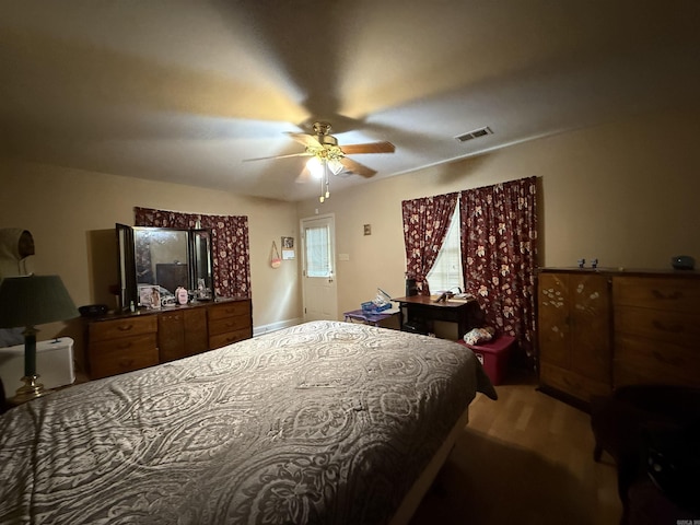 bedroom featuring wood finished floors and a ceiling fan