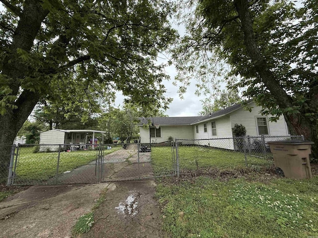 view of front of home with a gate and driveway