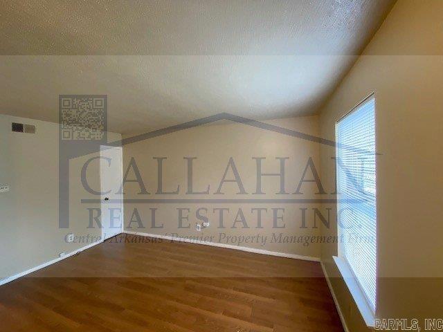 110 Rim Rock Pl, North Little Rock, AR 72116 - additional living space with wood finished floors and lofted ceiling