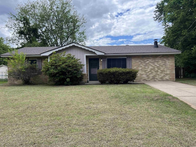 1302 Collins Dr, Pine Bluff, AR 71601 - single story home with brick siding and a front yard