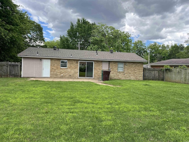 1302 Collins Dr, Pine Bluff, AR 71601 - rear view of property featuring a patio area and brick siding