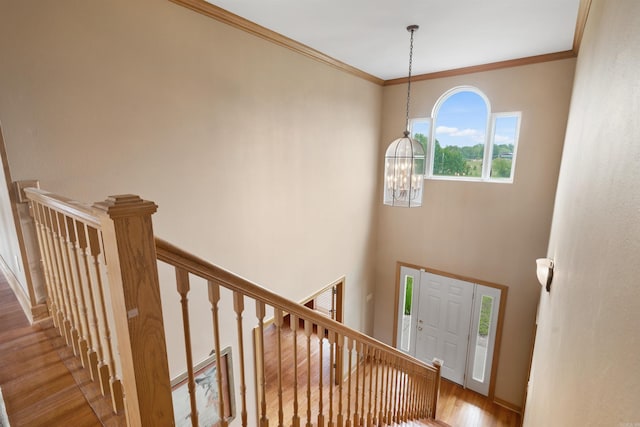 1325 El Dorado, Benton, AR 72019 - staircase featuring a chandelier, wood finished floors, and ornamental molding
