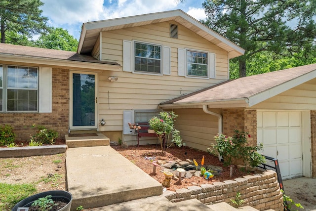106 Gareth Ct, Hot Springs National Park, AR 71913 - view of front of property with a garage, brick siding, and roof with shingles