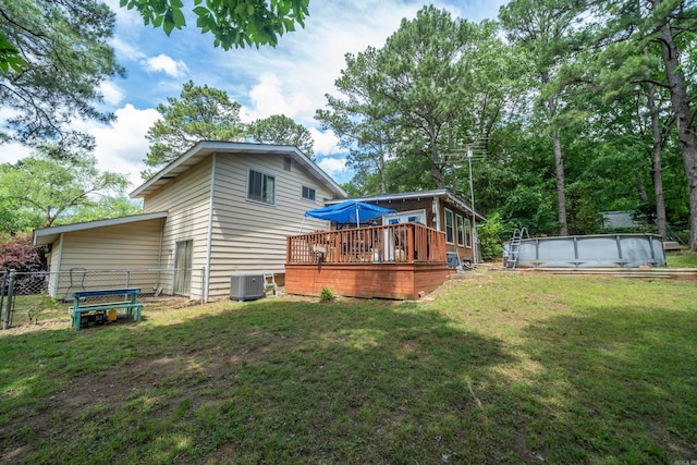 106 Gareth Ct, Hot Springs National Park, AR 71913 - back of house featuring a deck, cooling unit, and an outdoor pool