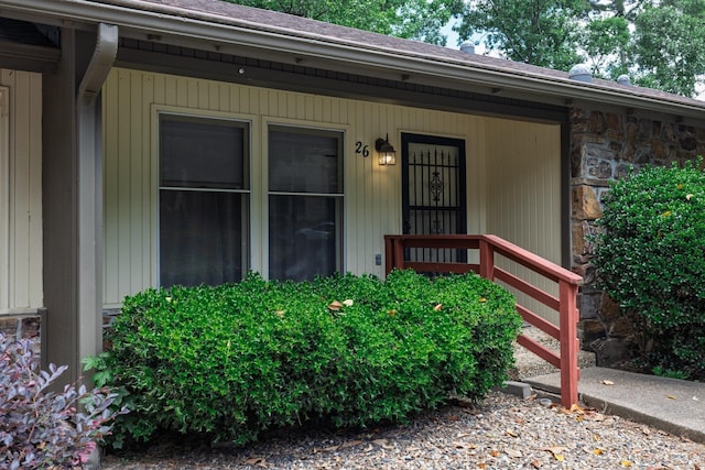 26 Destino Way, Hot Springs Village, AR 71909 - view of exterior entry featuring stone siding and a porch