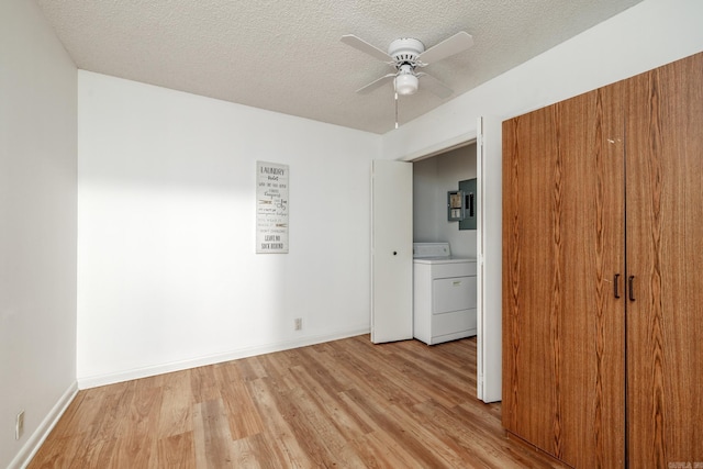 26 Destino Way, Hot Springs Village, AR 71909 - unfurnished bedroom featuring washer / dryer, light wood-type flooring, a textured ceiling, baseboards, and ceiling fan
