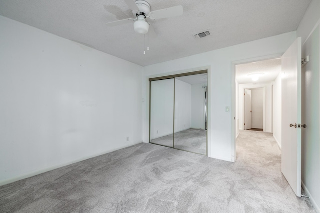 26 Destino Way, Hot Springs Village, AR 71909 - unfurnished bedroom featuring carpet, a closet, a textured ceiling, and a ceiling fan
