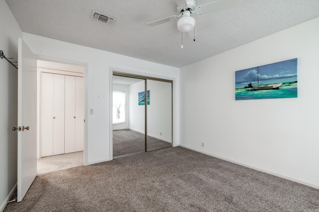 26 Destino Way, Hot Springs Village, AR 71909 - unfurnished bedroom with carpet, a textured ceiling, a closet, a ceiling fan, and baseboards
