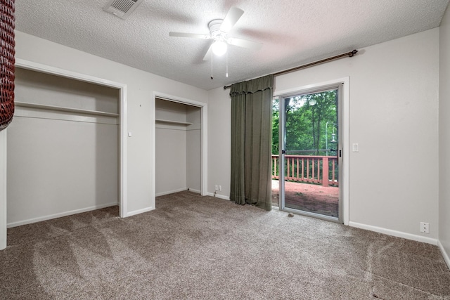 26 Destino Way, Hot Springs Village, AR 71909 - unfurnished bedroom featuring access to outside, a textured ceiling, two closets, carpet floors, and a ceiling fan
