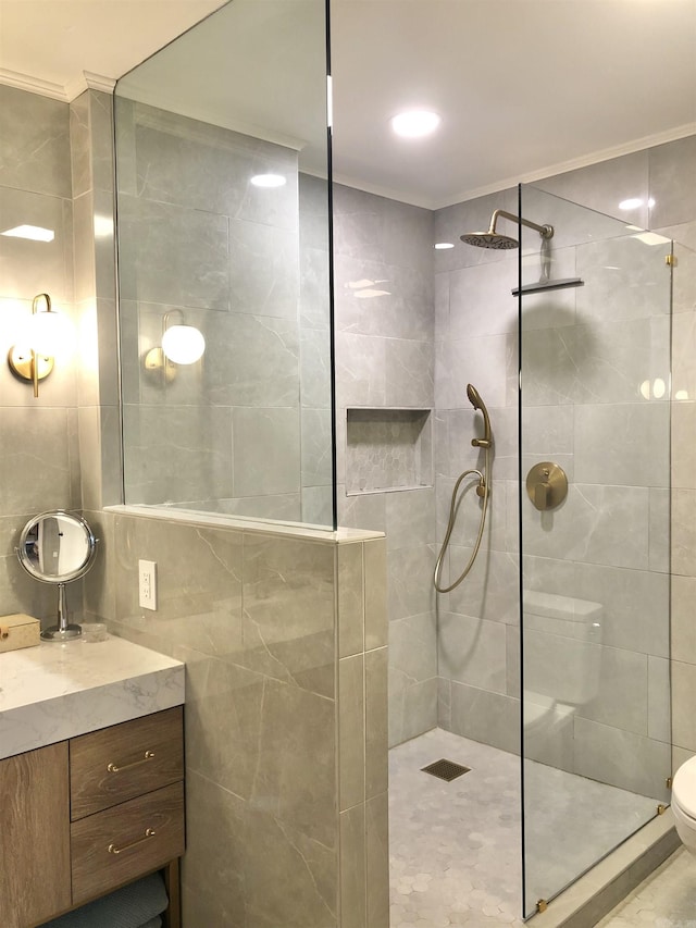 501 Belvedere Dr Unit C-1, Hot Springs, AR 71901 - bathroom featuring tile walls, walk in shower, vanity, toilet, and ornamental molding