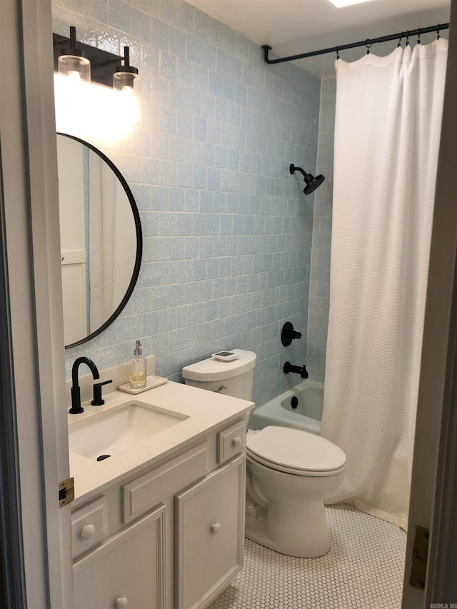 501 Belvedere Dr Unit C-1, Hot Springs, AR 71901 - full bathroom featuring tile walls, shower / bath combination with curtain, tile patterned flooring, vanity, and toilet