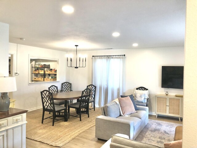 501 Belvedere Dr Unit C-1, Hot Springs, AR 71901 - living area with a chandelier, light wood-style floors, recessed lighting, and baseboards