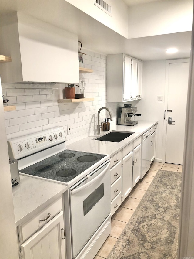 501 Belvedere Dr Unit C-1, Hot Springs, AR 71901 - kitchen with white appliances, a sink, light tile patterned floors, and backsplash
