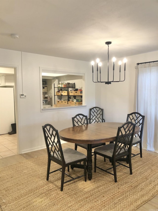 501 Belvedere Dr Unit C-1, Hot Springs, AR 71901 - dining room featuring a chandelier, baseboards, and light tile patterned flooring