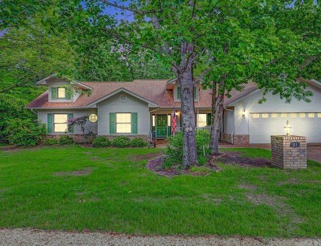 21 Conquista Ln, Hot Springs Village, AR 71909 - view of front of house with a front lawn, an attached garage, and roof with shingles