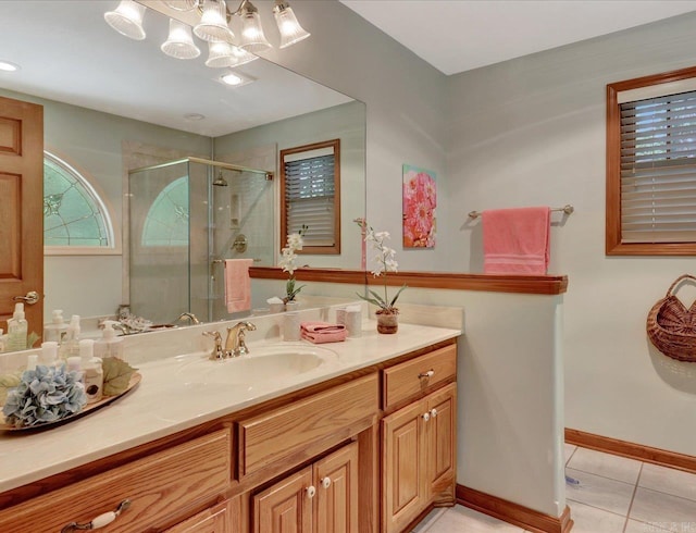 21 Conquista Ln, Hot Springs Village, AR 71909 - bathroom featuring tile patterned flooring, vanity, a stall shower, baseboards, and a chandelier