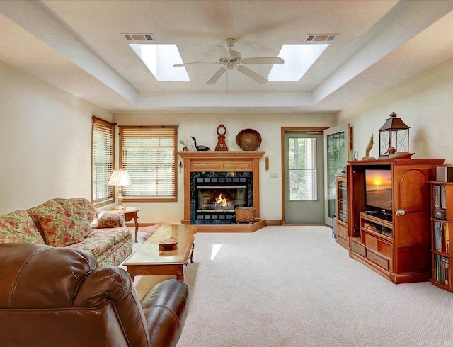 21 Conquista Ln, Hot Springs Village, AR 71909 - living room featuring a skylight, light carpet, and a tray ceiling