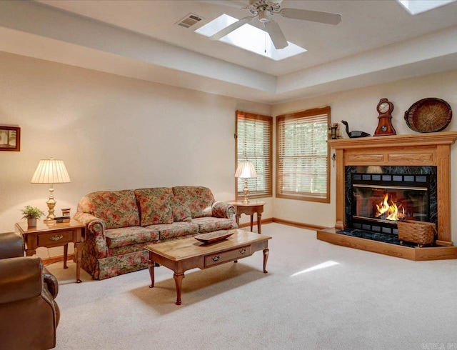 21 Conquista Ln, Hot Springs Village, AR 71909 - carpeted living room with a ceiling fan, a premium fireplace, and baseboards