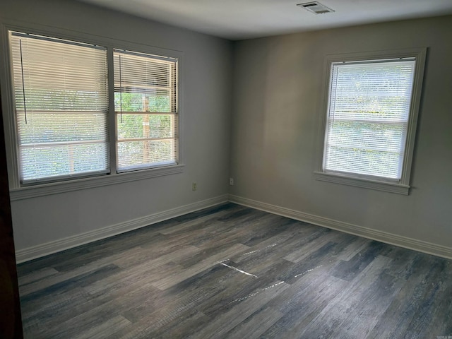 153 Pinehill Rd, Hot Springs, AR 71913 - empty room featuring dark wood-style floors, plenty of natural light, and baseboards
