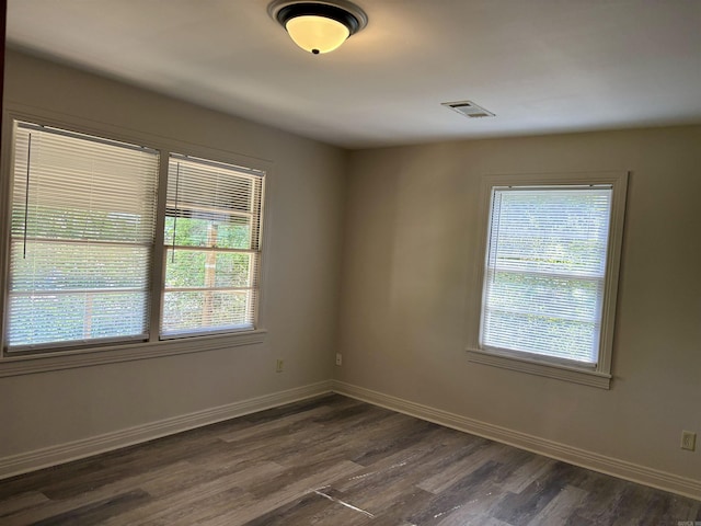 153 Pinehill Rd, Hot Springs, AR 71913 - empty room featuring dark wood-style flooring, healthy amount of natural light, and baseboards