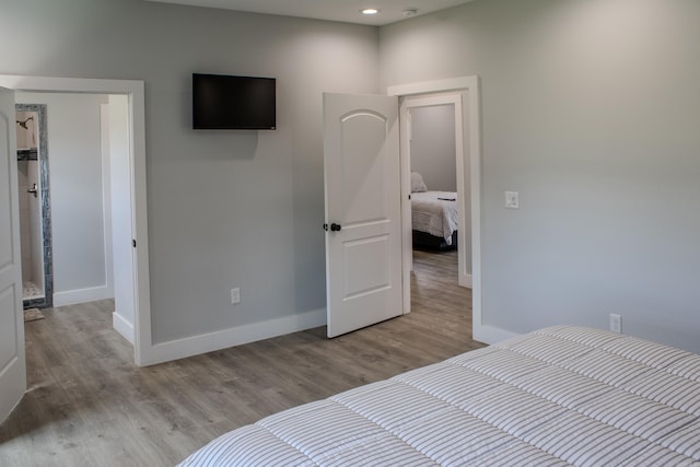 135 Serenity Loop, Glenwood, AR 71943 - bedroom featuring baseboards, wood finished floors, and recessed lighting