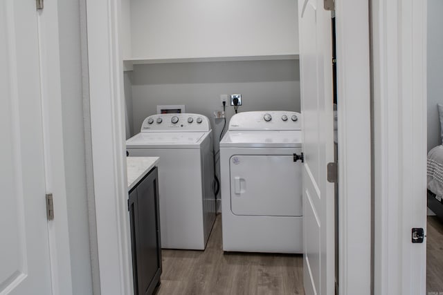 135 Serenity Loop, Glenwood, AR 71943 - washroom featuring independent washer and dryer and light wood-type flooring