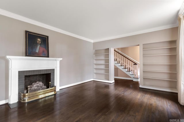 2424 N Fillmore St, Little Rock, AR 72207 - unfurnished living room with built in features, baseboards, wood finished floors, a brick fireplace, and ornamental molding