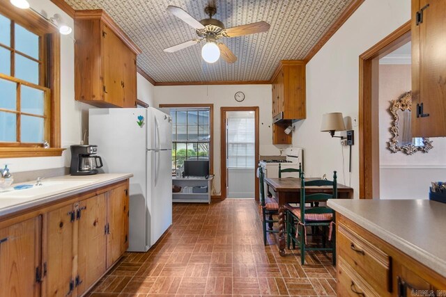 2424 N Fillmore St, Little Rock, AR 72207 - kitchen featuring white appliances, brick patterned floors, ceiling fan, ornamental molding, and light countertops