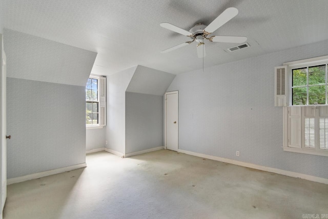2424 N Fillmore St, Little Rock, AR 72207 - bonus room featuring healthy amount of natural light, vaulted ceiling, baseboards, a ceiling fan, and carpet floors