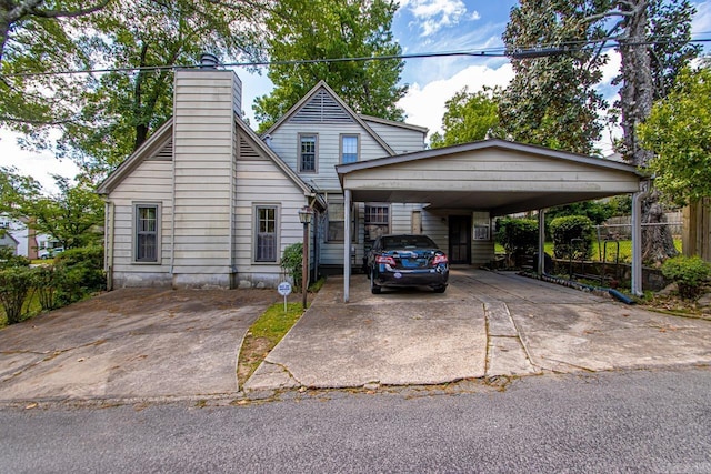 2424 N Fillmore St, Little Rock, AR 72207 - view of front of home featuring a chimney and concrete driveway