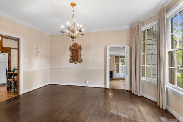 2424 N Fillmore St, Little Rock, AR 72207 - unfurnished dining area featuring a chandelier, wood finished floors, ornamental molding, and baseboards