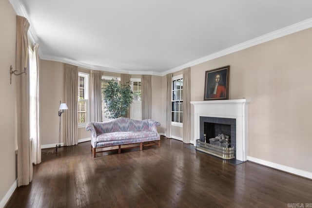 2424 N Fillmore St, Little Rock, AR 72207 - living room featuring baseboards, healthy amount of natural light, wood finished floors, a fireplace, and crown molding