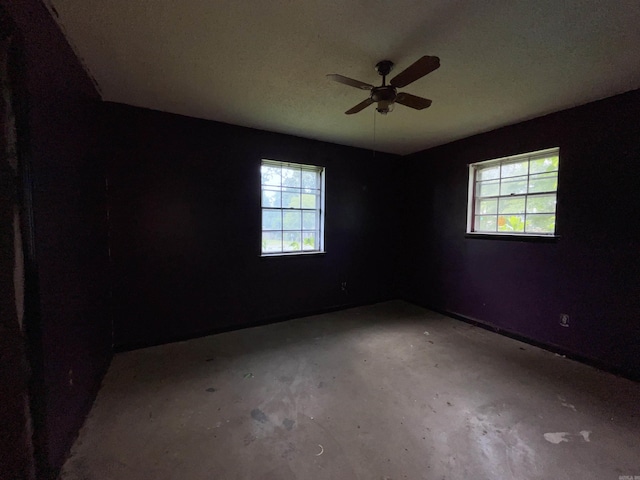 1602 Harmon Dr, Benton, AR 72015 - unfurnished room featuring healthy amount of natural light, unfinished concrete floors, and ceiling fan