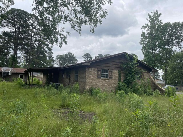 1602 Harmon Dr, Benton, AR 72015 - view of side of home with brick siding
