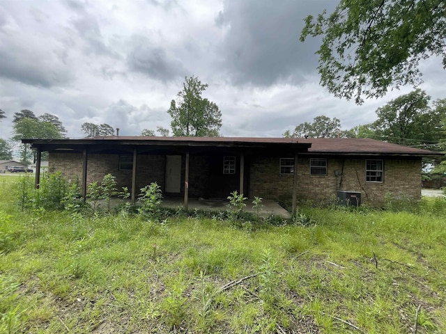 1602 Harmon Dr, Benton, AR 72015 - back of house with brick siding and cooling unit