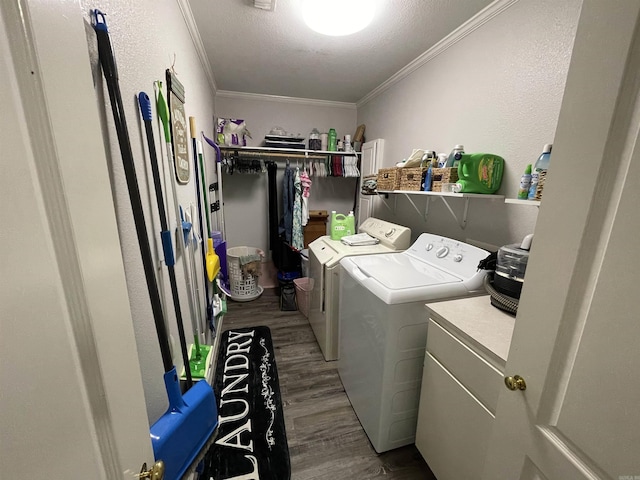 142 Timber Ridge Ln, El Dorado, AR 71730 - laundry area featuring washing machine and clothes dryer, wood finished floors, and crown molding