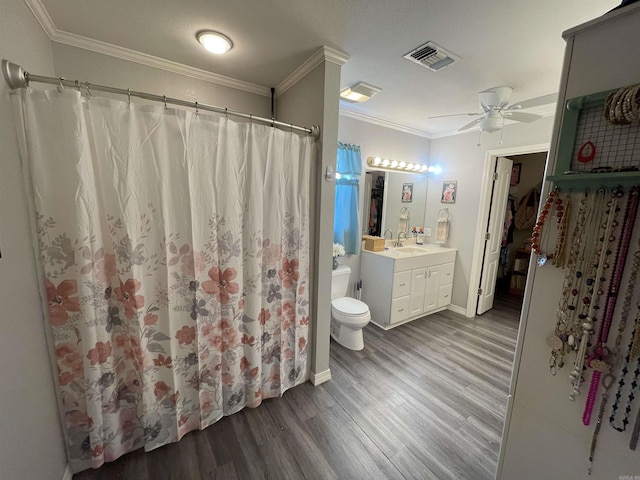 142 Timber Ridge Ln, El Dorado, AR 71730 - full bathroom with wood finished floors, ceiling fan, toilet, vanity, and crown molding