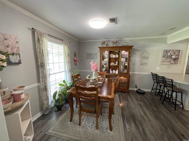 142 Timber Ridge Ln, El Dorado, AR 71730 - dining area with wood finished floors, ornamental molding, baseboards, and a textured ceiling