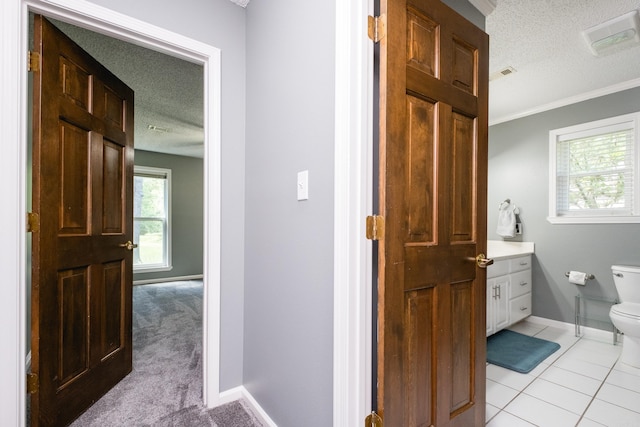 11 Blue Mountain Dr, Maumelle, AR 72113 - bathroom featuring a textured ceiling, toilet, vanity, baseboards, and ornamental molding