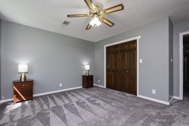 11 Blue Mountain Dr, Maumelle, AR 72113 - unfurnished bedroom featuring carpet, a closet, a textured ceiling, baseboards, and a ceiling fan