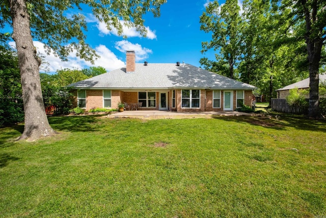 11 Blue Mountain Dr, Maumelle, AR 72113 - back of house with a chimney, a patio area, a yard, and brick siding