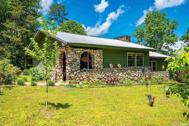4915 Albert Pike Rd, Hot Springs, AR 71913 - view of home's exterior with stone siding, a yard, a chimney, and metal roof