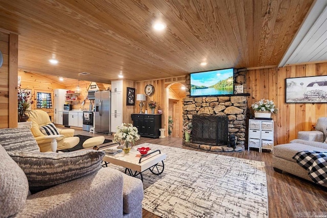 4915 Albert Pike Rd, Hot Springs, AR 71913 - living area with wooden ceiling, wooden walls, a fireplace, wood finished floors, and arched walkways