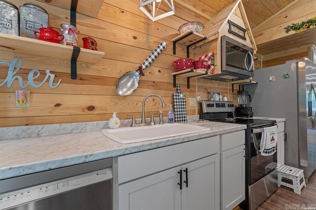 4915 Albert Pike Rd, Hot Springs, AR 71913 - kitchen featuring stainless steel appliances, a sink, wood walls, wood finished floors, and open shelves