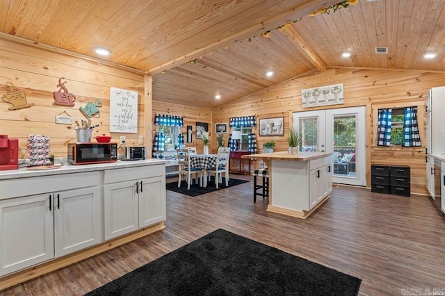 4915 Albert Pike Rd, Hot Springs, AR 71913 - kitchen featuring wood walls, lofted ceiling, wooden ceiling, dark wood-style floors, and black microwave