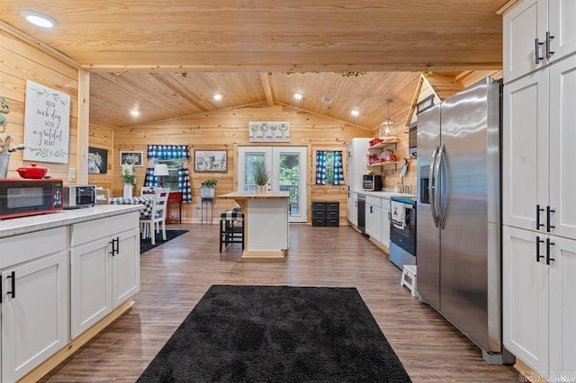 4915 Albert Pike Rd, Hot Springs, AR 71913 - kitchen with stainless steel fridge with ice dispenser, wooden walls, wood ceiling, vaulted ceiling, and wood finished floors